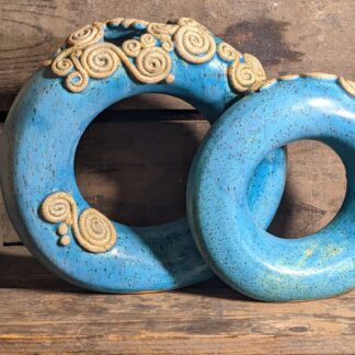 Double donut vase - two toroid forms in PSH 455 speckle clay with matte turquoise glaze and unglazed embellishments.